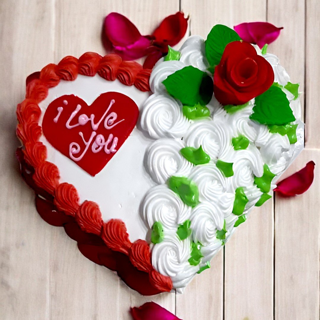 Heart-shaped Valentine's Day cake with "I love you" message by Better Gift Flowers