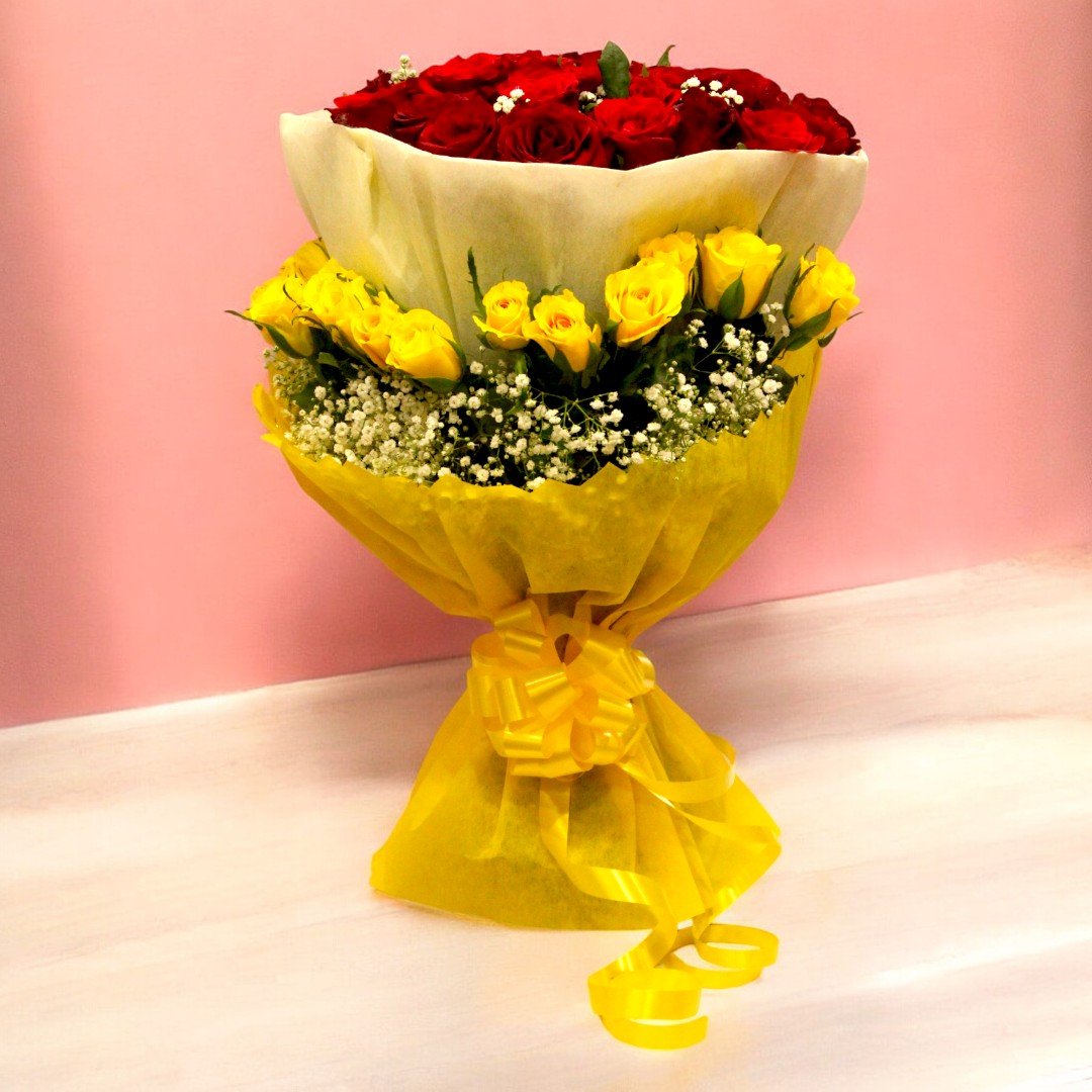 A charming bouquet of 30 red roses and 15 yellow roses wrapped in yellow paper by BetterGiftFlowers