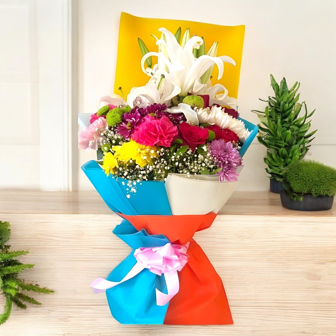 A vibrant bouquet of mixed flowers including lilies, carnations, and chrysanthemums by BetterGiftFlowers.