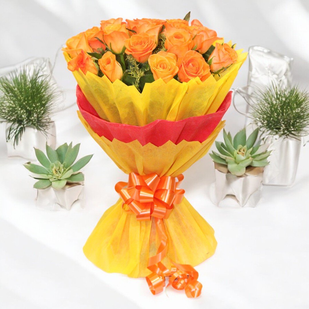 A stunning bouquet of 20 fresh orange roses wrapped in yellow and red paper, available at BetterGiftFlowers™.