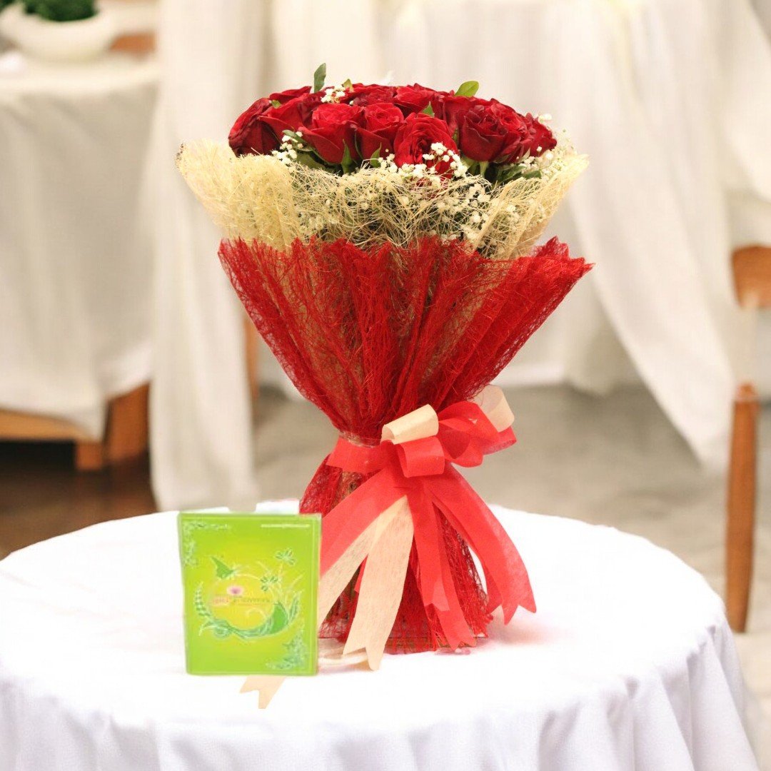 BetterGiftFlowers Timeless Beauty Jute Bouquet of 24 Red Roses on a table with white background.