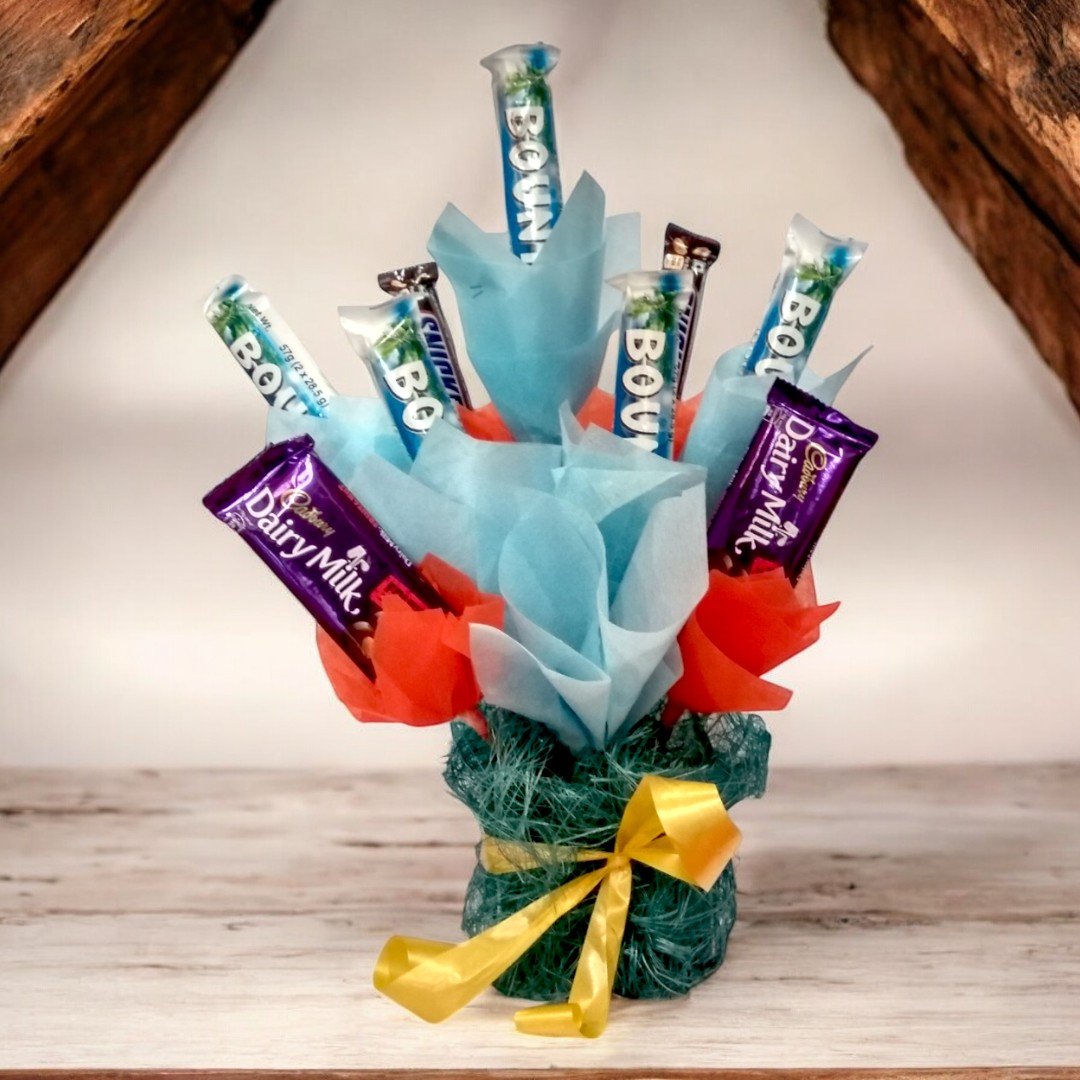 Tempting Chocolate Hamper with Bounty, Dairy Milk, and Snickers by BetterGiftFlowers.