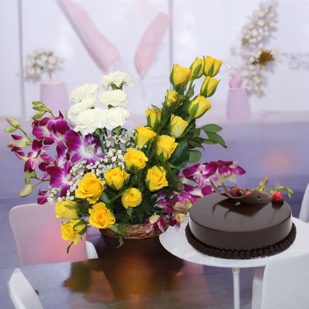 Alluring Basket Combo from BetterGiftFlowers featuring a flower arrangement of yellow roses, orchids, and carnations with a chocolate cake.