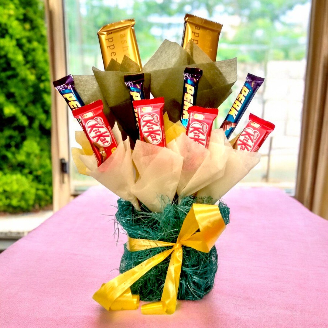 Appealing Chocolate Hamper by BetterGiftFlowers, featuring Perk and KitKat bars arranged in elegant wrapping.