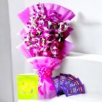 Image of "Elegant N Sweet" purple orchid bouquet with Dairy Milk chocolates and a greeting card by BetterGiftFlowers.