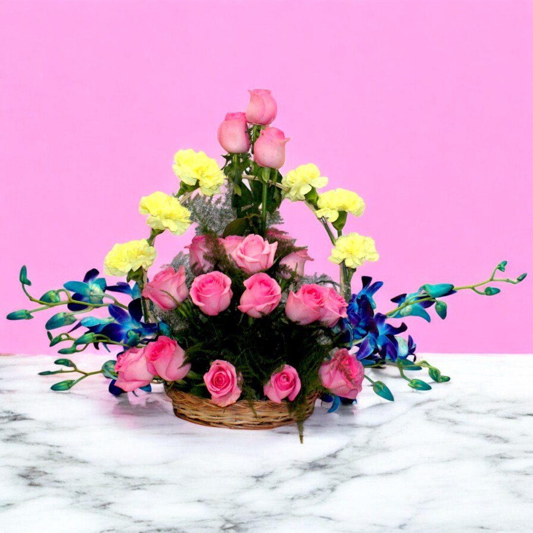 Image of "Mix Flowers Basket" with pink roses, yellow carnations, and blue orchids arranged by BetterGiftFlowers.