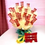 BetterGiftFlowers Pearl Rakhi and KitKat chocolate bouquet hamper.