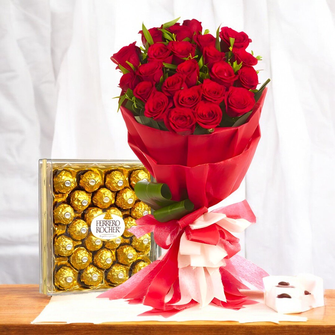 Beautiful red rose bouquet with a box of Ferrero Rocher chocolates placed on a wooden surface by BetterGiftFlowers.