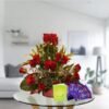 red roses arrangement and dairy milk chocolates