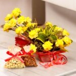 Bright yellow carnations with a bag of almonds and cashews from BetterGiftFlowers