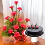 Better Gift Flowers pink carnations basket with a rich chocolate truffle cake combo