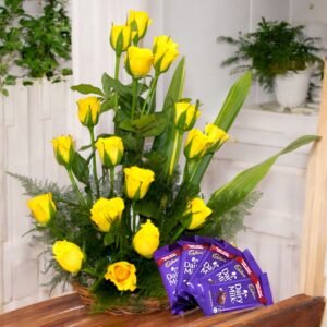 A stunning basket of fresh yellow roses with Dairy Milk chocolates by BetterGiftFlowers.