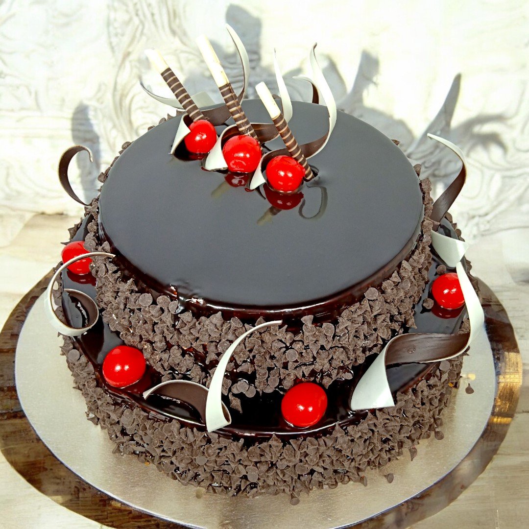 Better Gift Flowers 2 Tier Choco Chip Cake with cherry and chocolate garnishing, perfect for gifting.