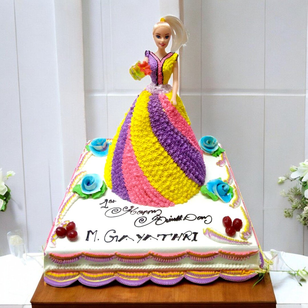 Beautiful doll cake by BetterGiftFlowers with intricate colorful design perfect for birthdays.