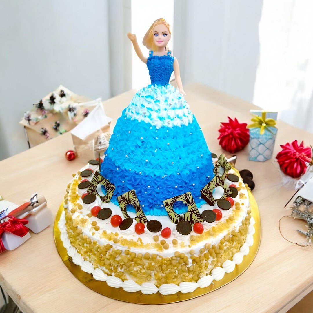 Charming Doll Cake by Better Gift Flowers, perfect for kids' birthdays, topped with a blue dress doll.