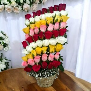 BetterGiftFlowers vibrant Layers of Roses arrangement with red, white, yellow, and pink roses.