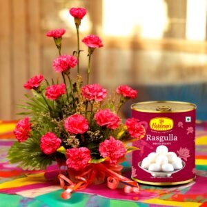 A beautiful bouquet of pink carnations with Haldiram's Rasgulla tin by Better Gift Flowers.