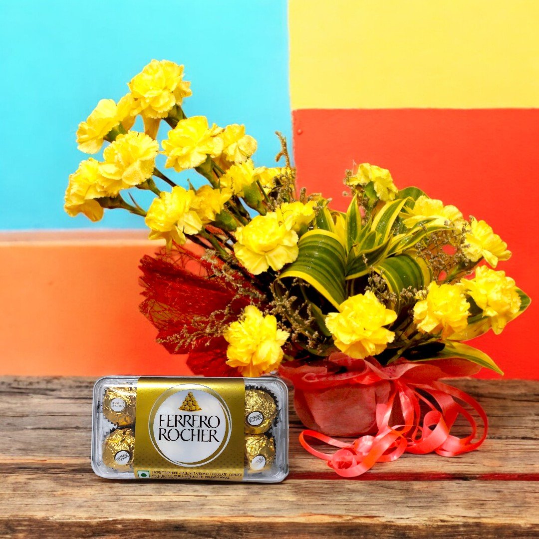 A vibrant arrangement of yellow carnations paired with Ferrero Rocher chocolates by Better Gift Flowers.