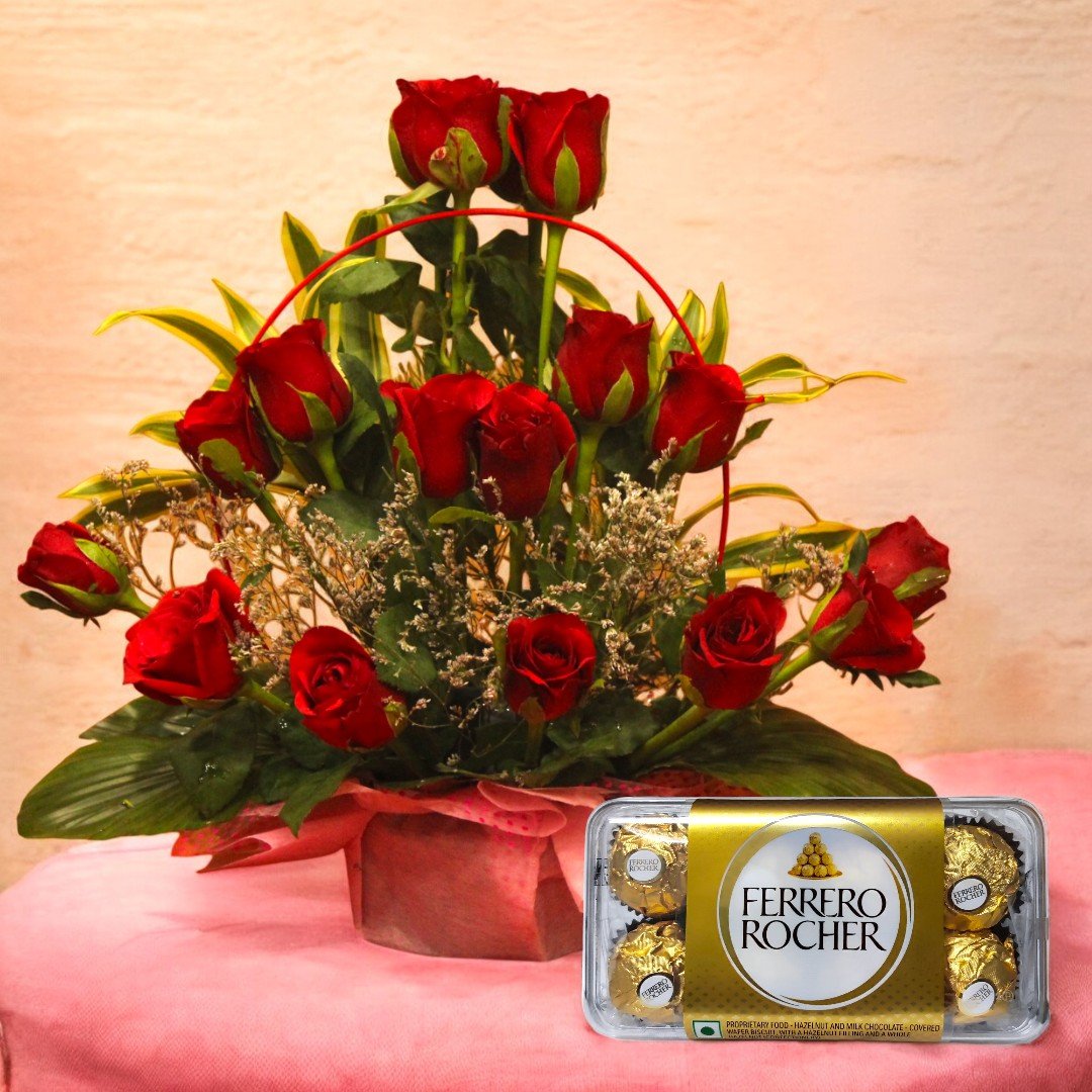 Beautiful red roses arrangement paired with Ferrero Rocher chocolates by BetterGiftFlowers.