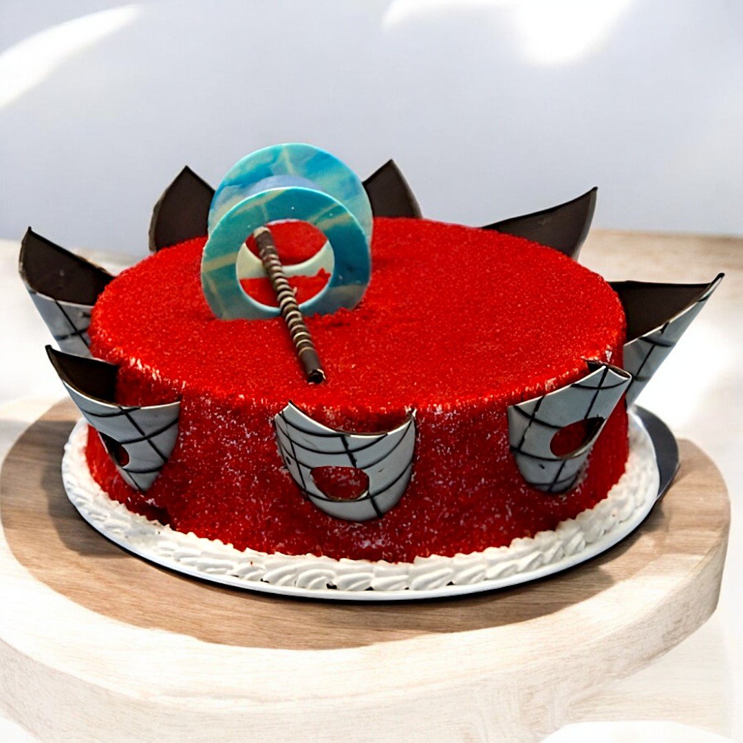 BetterGiftFlowers Red Velvet Round Cake with decorative chocolate shards and stylish Thor hammer topper.