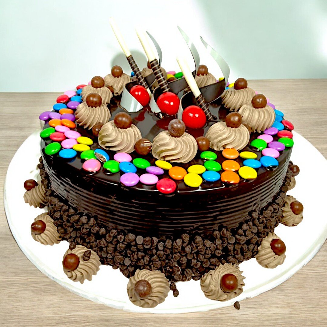 Chocolaty Chocochips Cake by BetterGiftFlowers with chocolate layers and vibrant gem toppings.