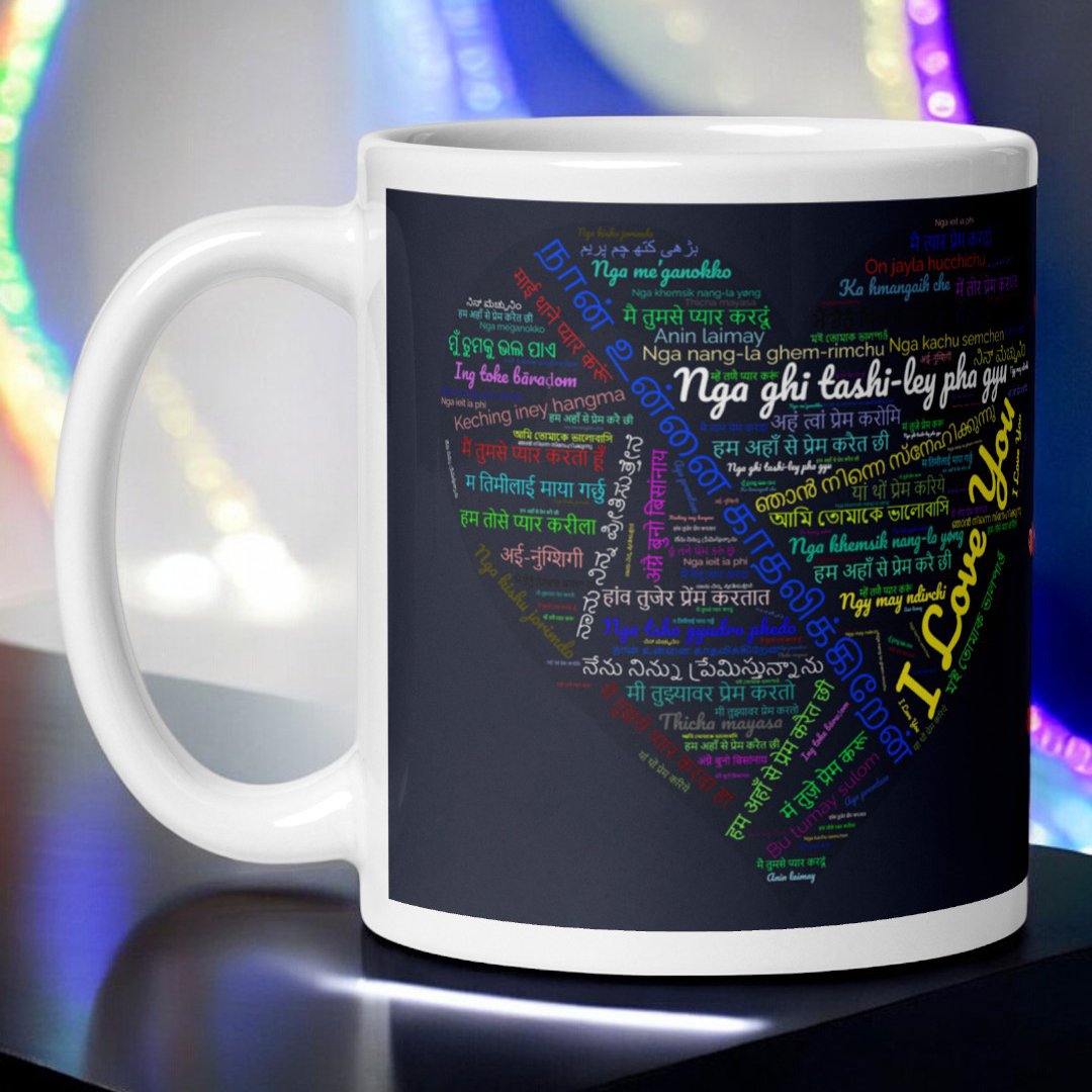 BetterGiftFlowers I Love You In 50 Languages Mug displaying the phrase 'I Love You' in various languages forming a heart shape on a black background.