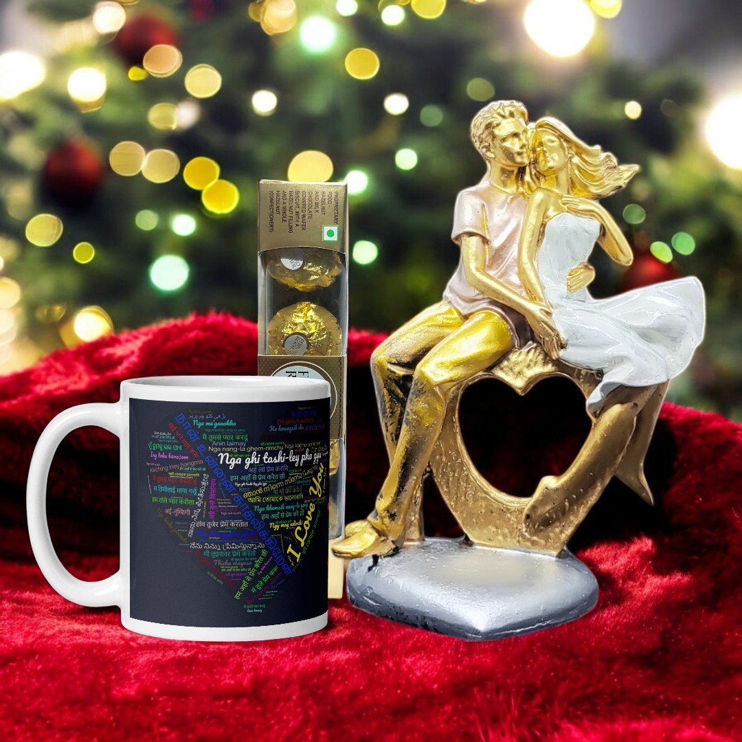 Better Gift Flowers romantic gift combo with a gold-plated couple figurine, a printed mug, and Ferrero Rocher chocolates placed against a festive background.